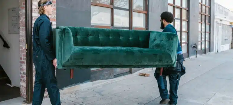 movers carrying sofa