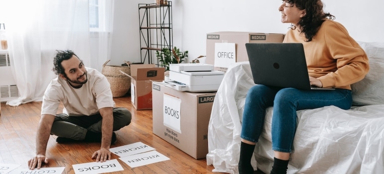 a couple organizing a home and office move simultaneously
