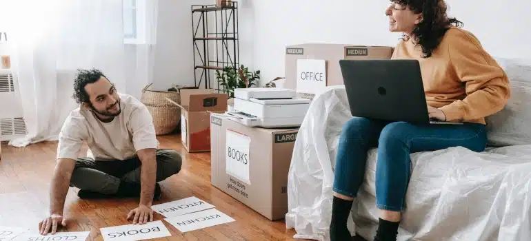 a couple organizing a home and office move simultaneously