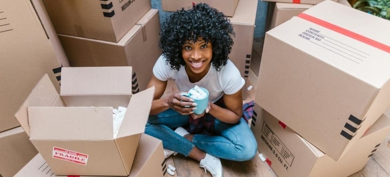 a woman surrounded by boxes
