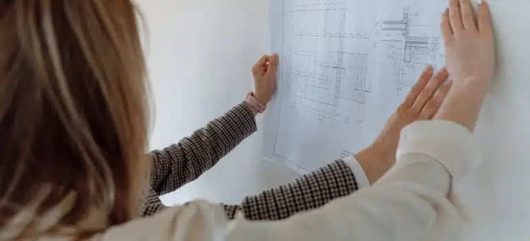 people looking at a floor plan