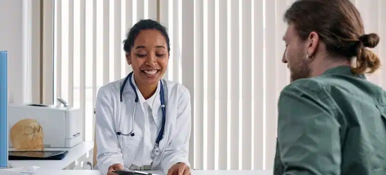 a doctor talking to a patient about moving a medical center in Florida