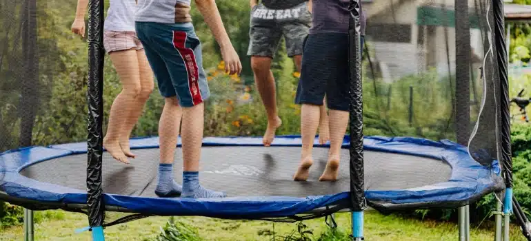 kids jumping on a trampoline