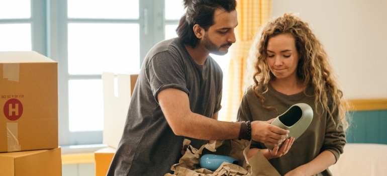 a couple about to pack and move a collection of antique ceramics to Miami beach