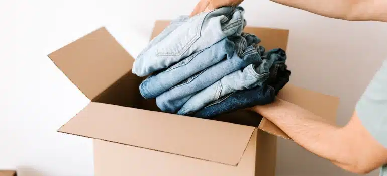 a man packing clothes