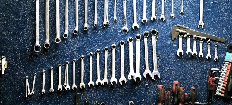 A set of tools hanging on a rack