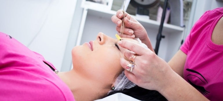 a woman doing skin care