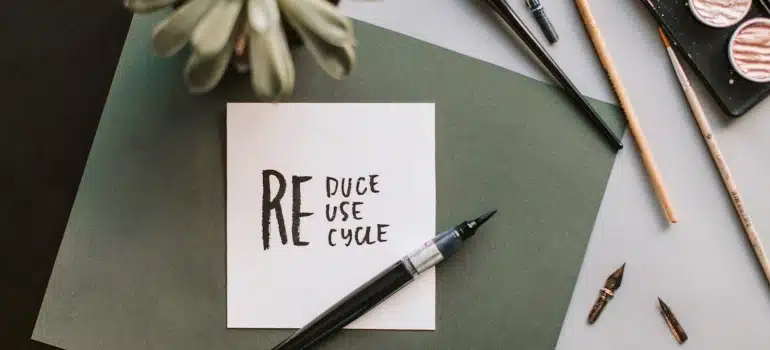 recycle, reduce, reuse written on a paper