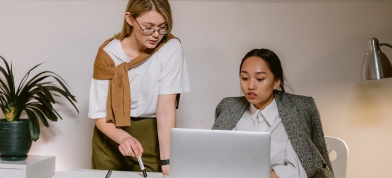 two women talking in the office