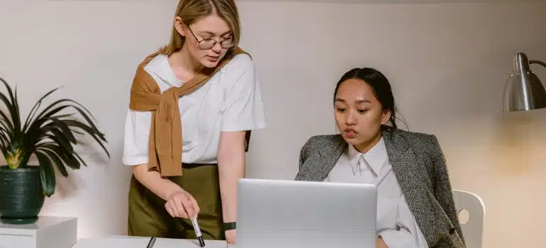 two women talking in the office