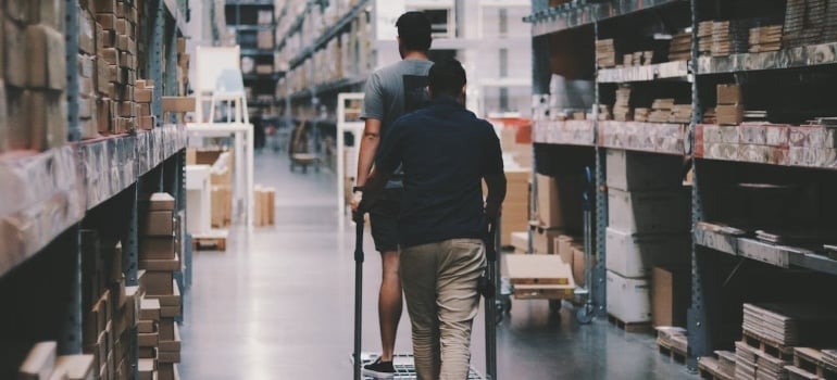a man in storage thinking about to use white glove moving and storage services when moving your business
