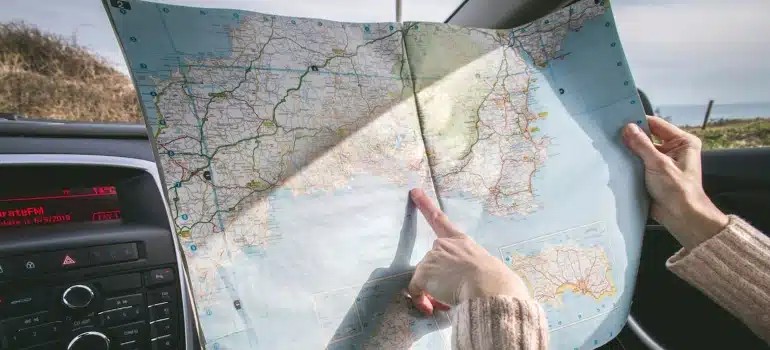 a person pointing at a map searching for the best Florida Cities for moving with pets 