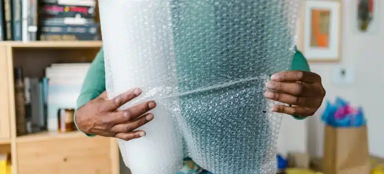 a man holding bubble wrap 