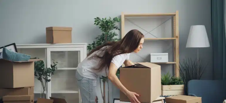 a woman about to organize home storage space after moving to Coconut Grove