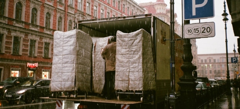 a man in a truck relocating to Miami during a rainstorm
