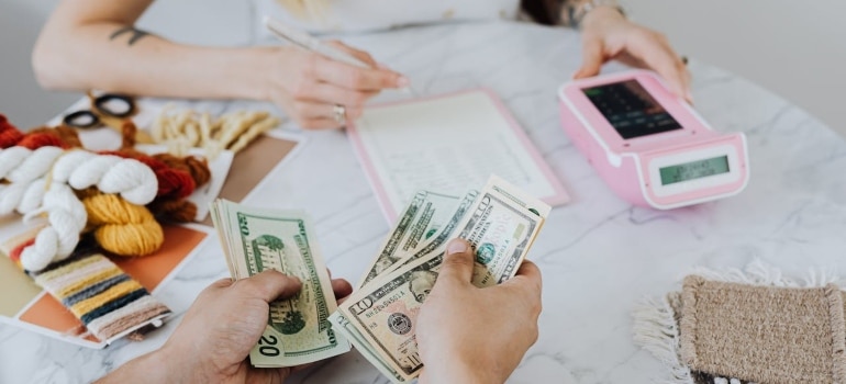 people calculating and trying to evaluate corporate movers in Miami