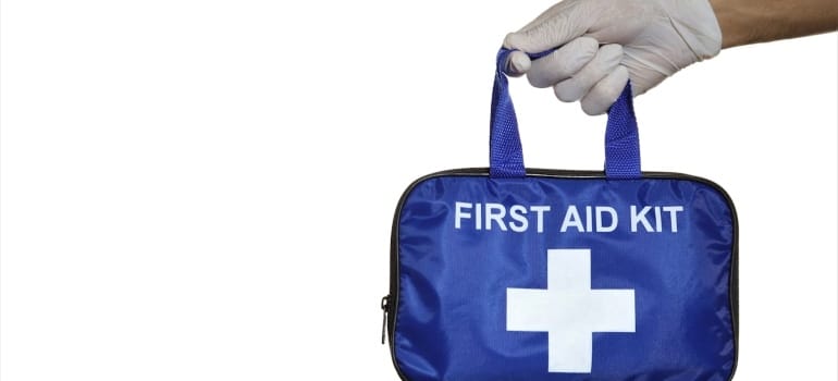 a person holding first aid kit