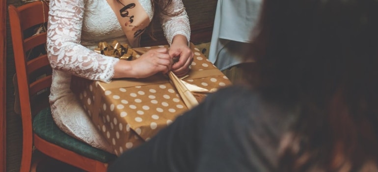 a bride holding a gift.