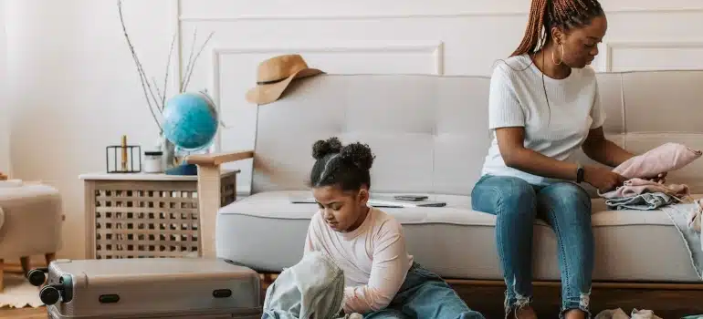 a woman packing with a child