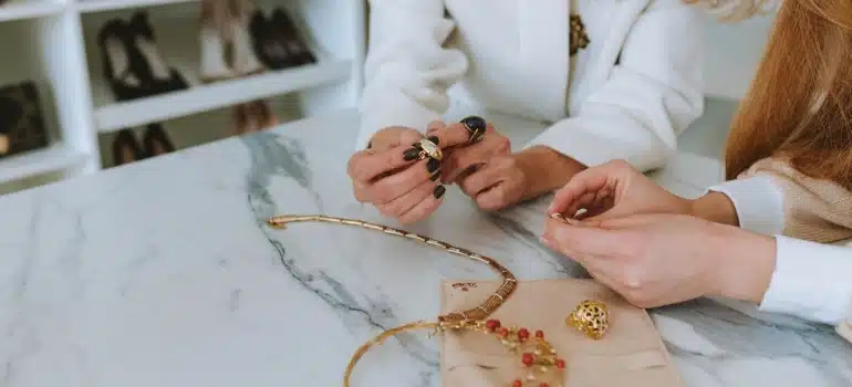 a woman about to sell jewelry to make some extra money by decluttering