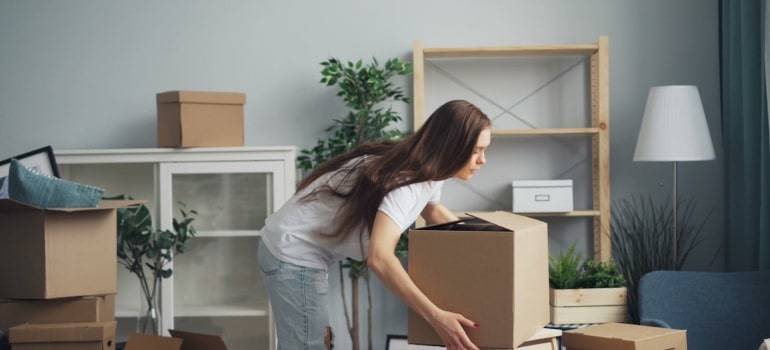 a woman lifting a box
