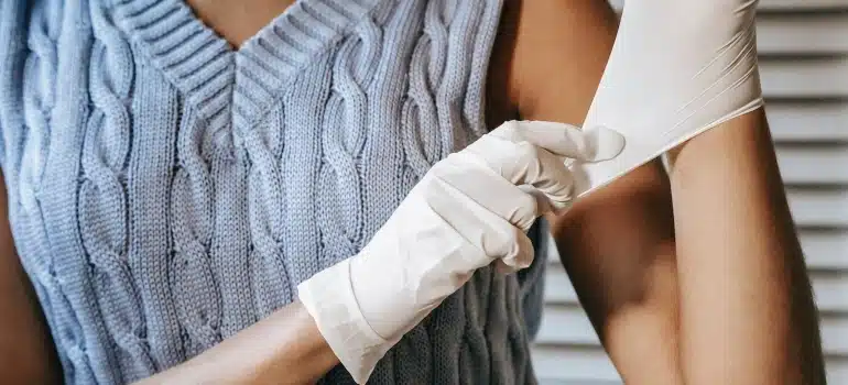 a woman wearing white gloves