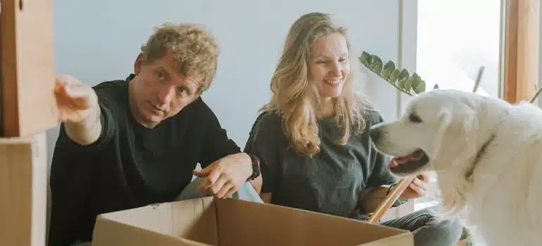 a couple packing with a pet