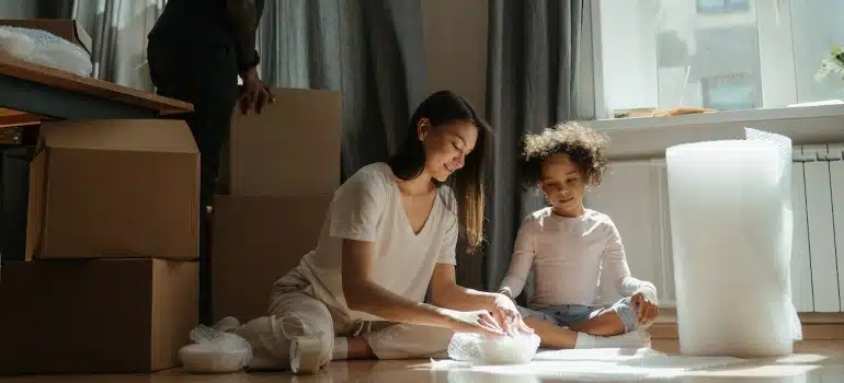 a mother and daughter packing china