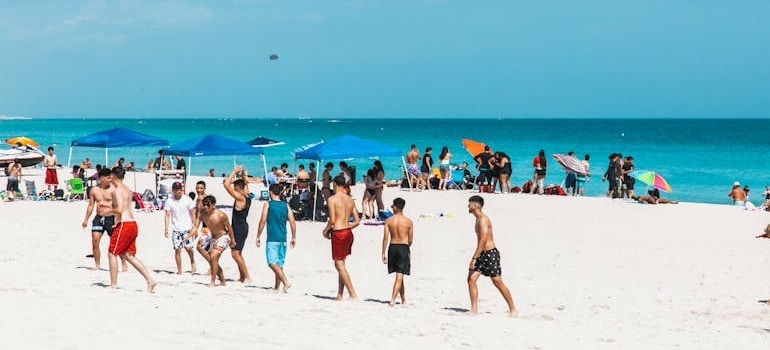 A group of people in swimsuits exploring the best beaches in Miami
