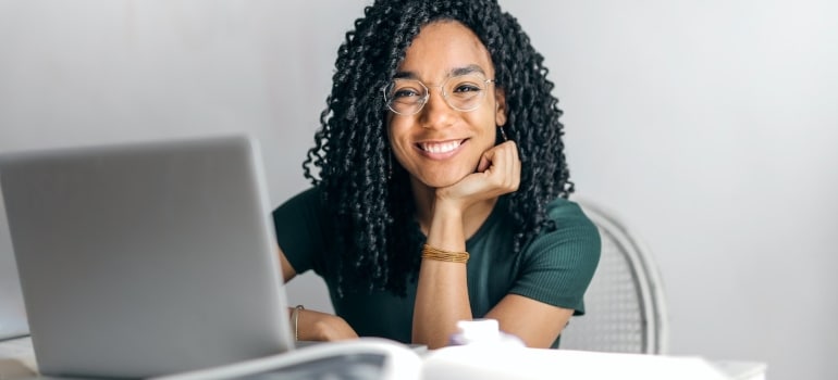 a woman browsing the net to find Miami office movers you can trust