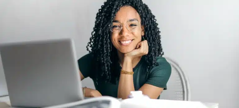 a woman browsing the net to find Miami office movers you can trust