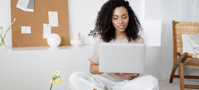 a woman looking at a laptop