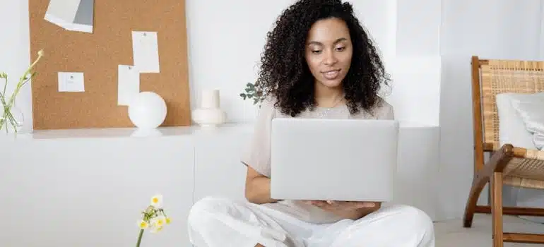 a woman looking at a laptop