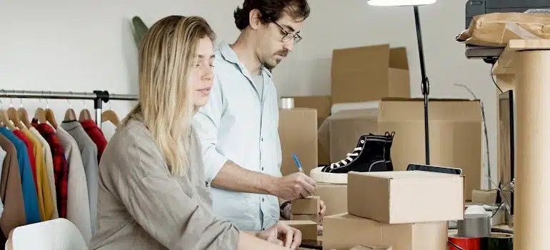 two people packing