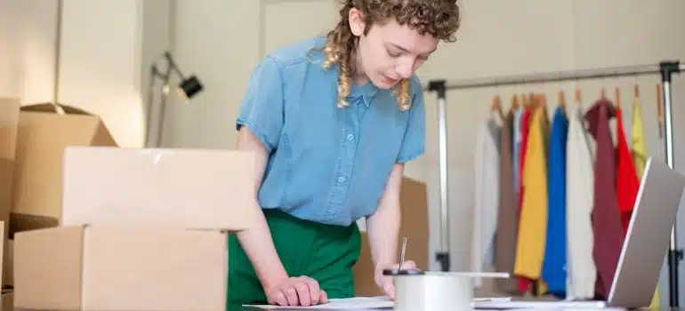 a woman in a retail store planning for relocating a fashion retail chain