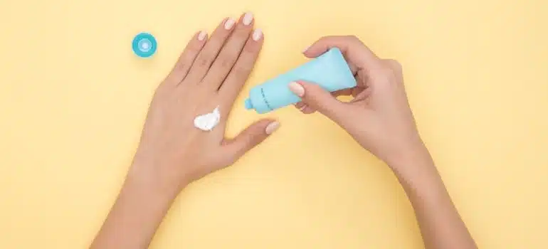 a person using sun cream