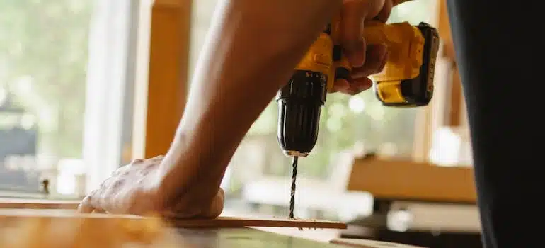 a man making a workbench and transforming a garage into a workshop