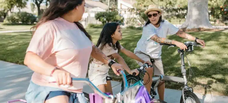 two women and a girl biking 