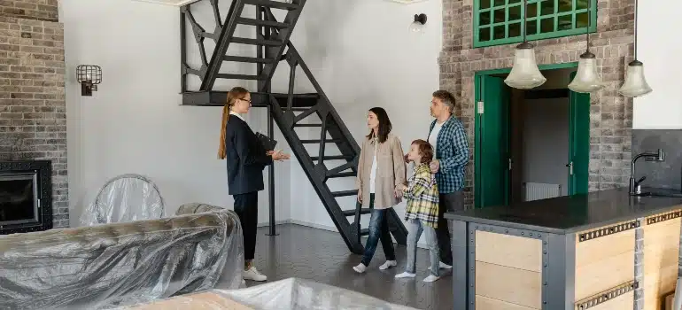 Realtor showing a family their potential new home, sparking excitement for the next step.