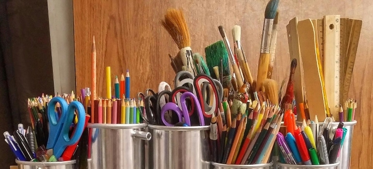 Pencils and paintbrushes for family activities in Coral Springs