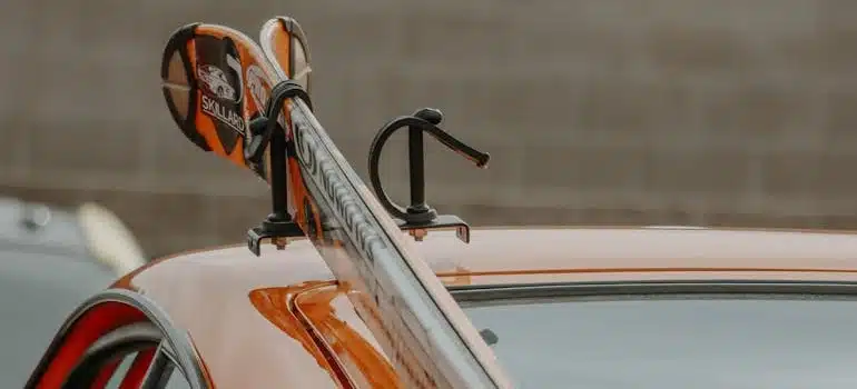 Skis on a car showing how to pack your ski gear for an interstate move