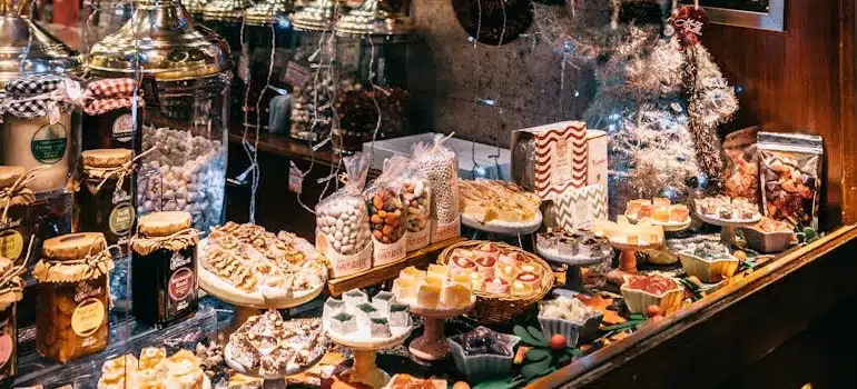 An open market stand with assortment of holiday sweets