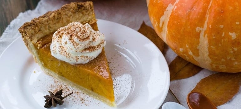 Delectable Sliced Pumpkin Pie on White Ceramic Plate