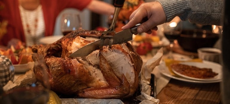 People at dinner after moving to Pompano Beach around Thanksgiving