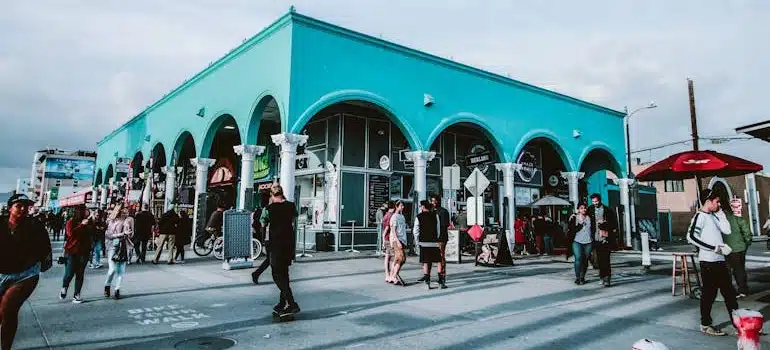 People walking in the street of LA after moving from Florida to California