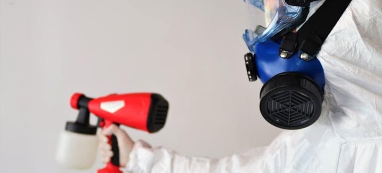  person in hazmat suit handling mold in your home in Davie