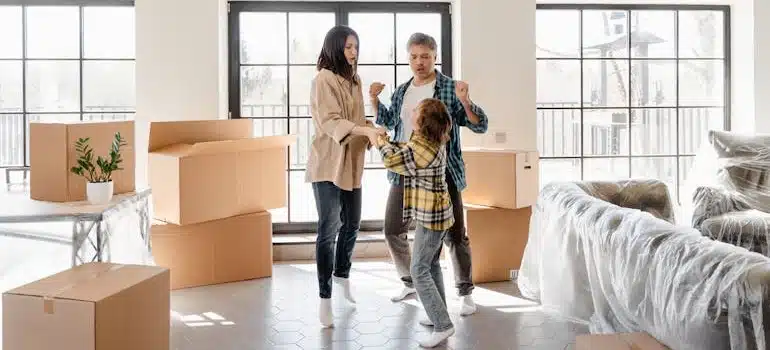 A Happy Family dancing after moving