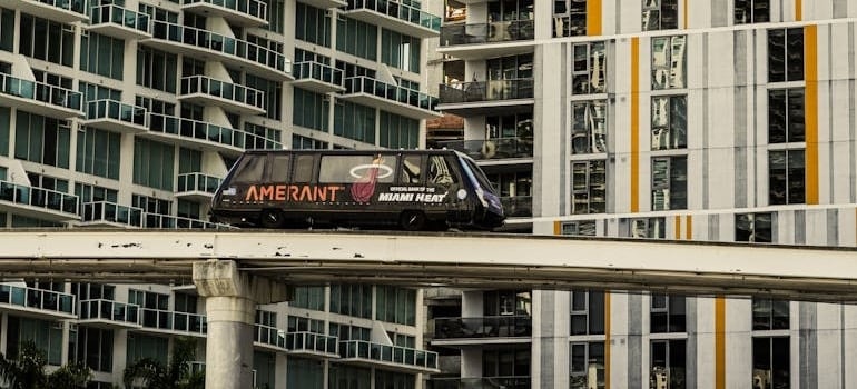 Modern Monorail Passing Miami High-rise Apartments