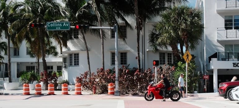 A man on a scooter who plans to live in Miami on a smaller budget