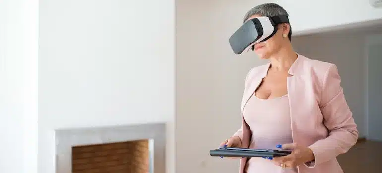 A Woman in Pink Wearing VR Goggles